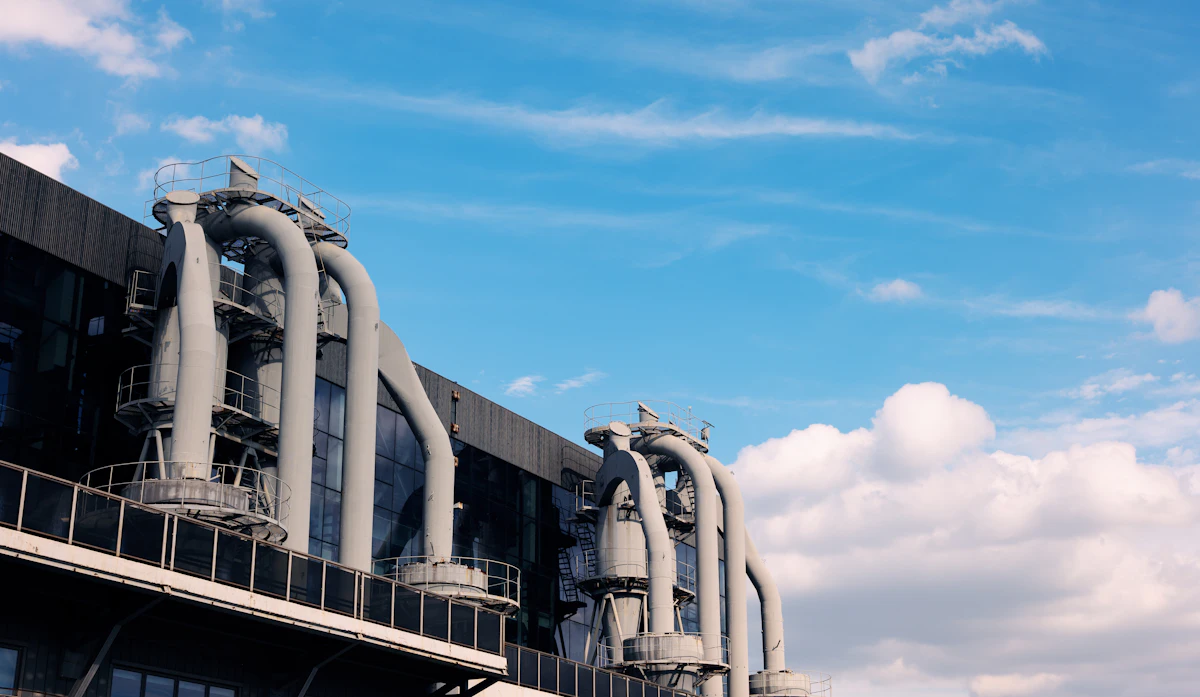 Factory building with large ventilation pipes